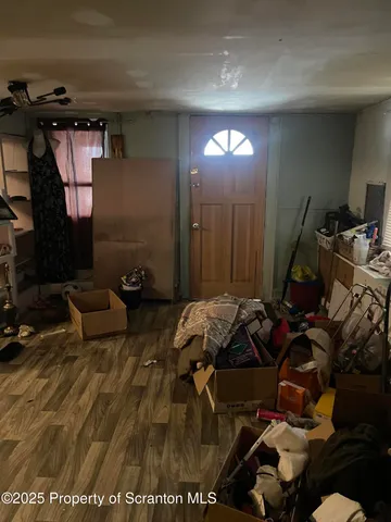 a bed room with a bed a couch and a television