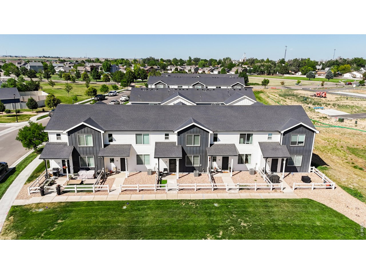 260 Pawnee Road, Unit D3 Ault, CO 80610 - Photo 30 of 44 Front aerial view with green space.