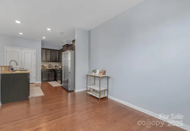 a view of kitchen with furniture and wooden floor