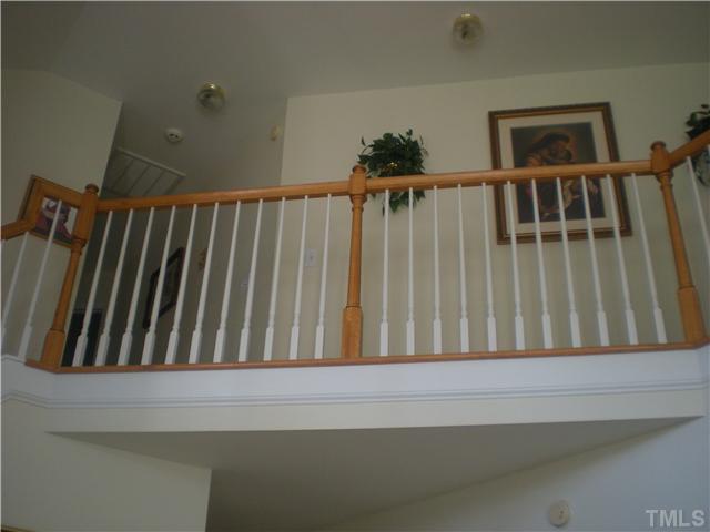 4313 Major Loring Way Raleigh, NC 27616 - Photo 3 of 4 a view of staircase with wooden floor