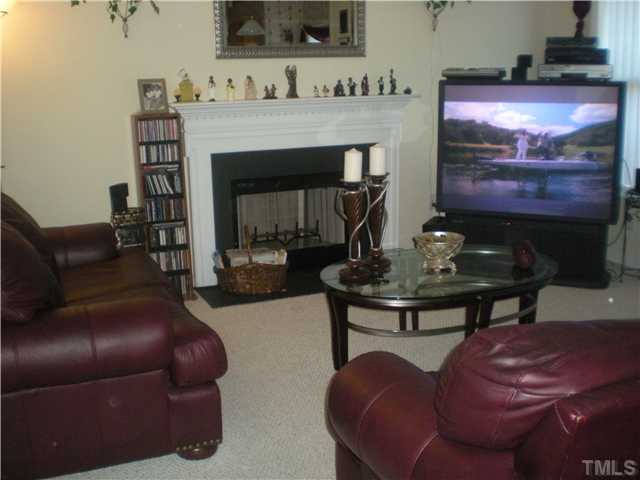 4313 Major Loring Way Raleigh, NC 27616 - Photo 4 of 4 a living room with furniture and a fireplace