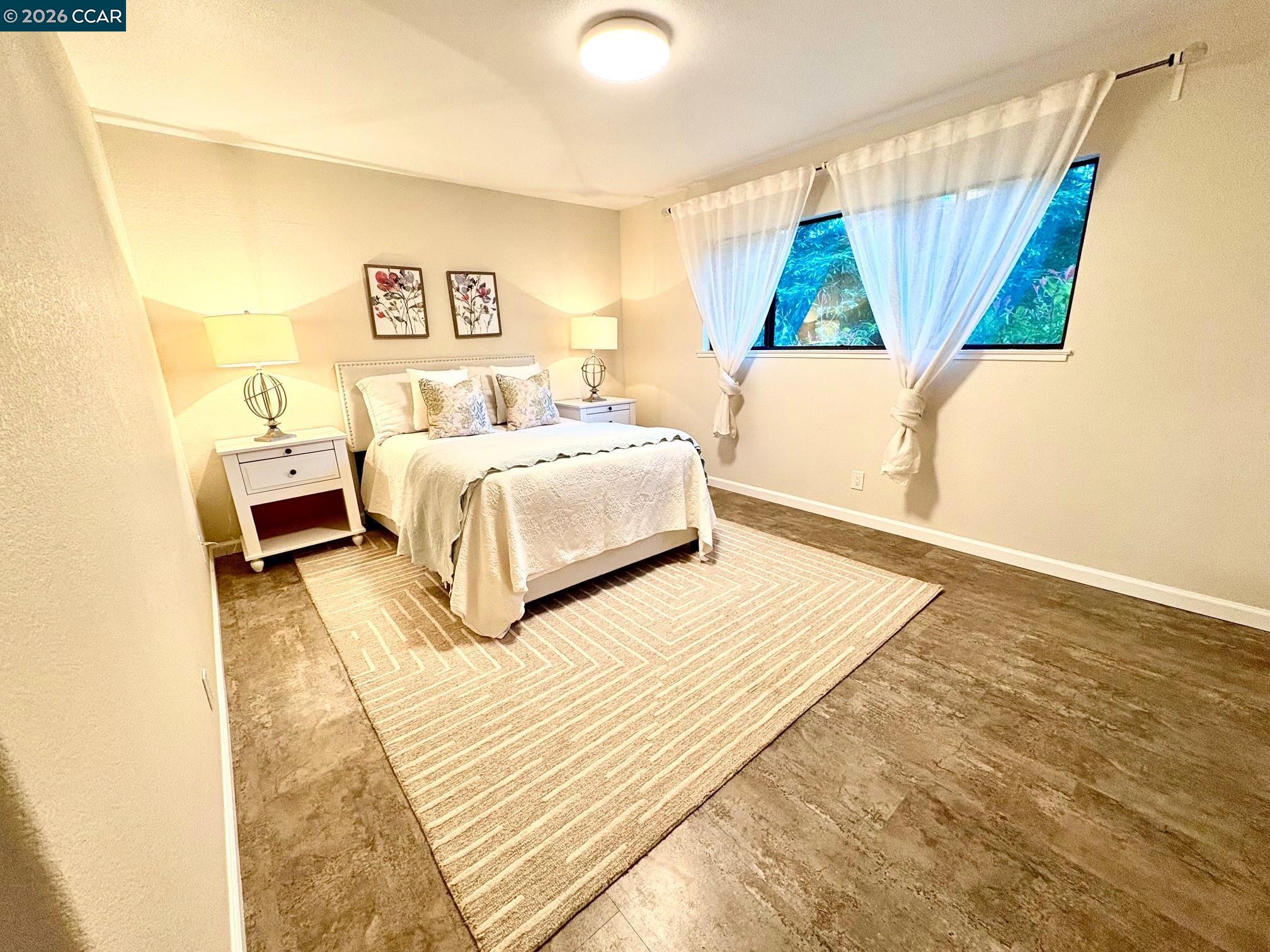 2589 Pebble Beach Loop Lafayette, CA 94549 - Photo 19 of 32 a bedroom with a bed and a large window