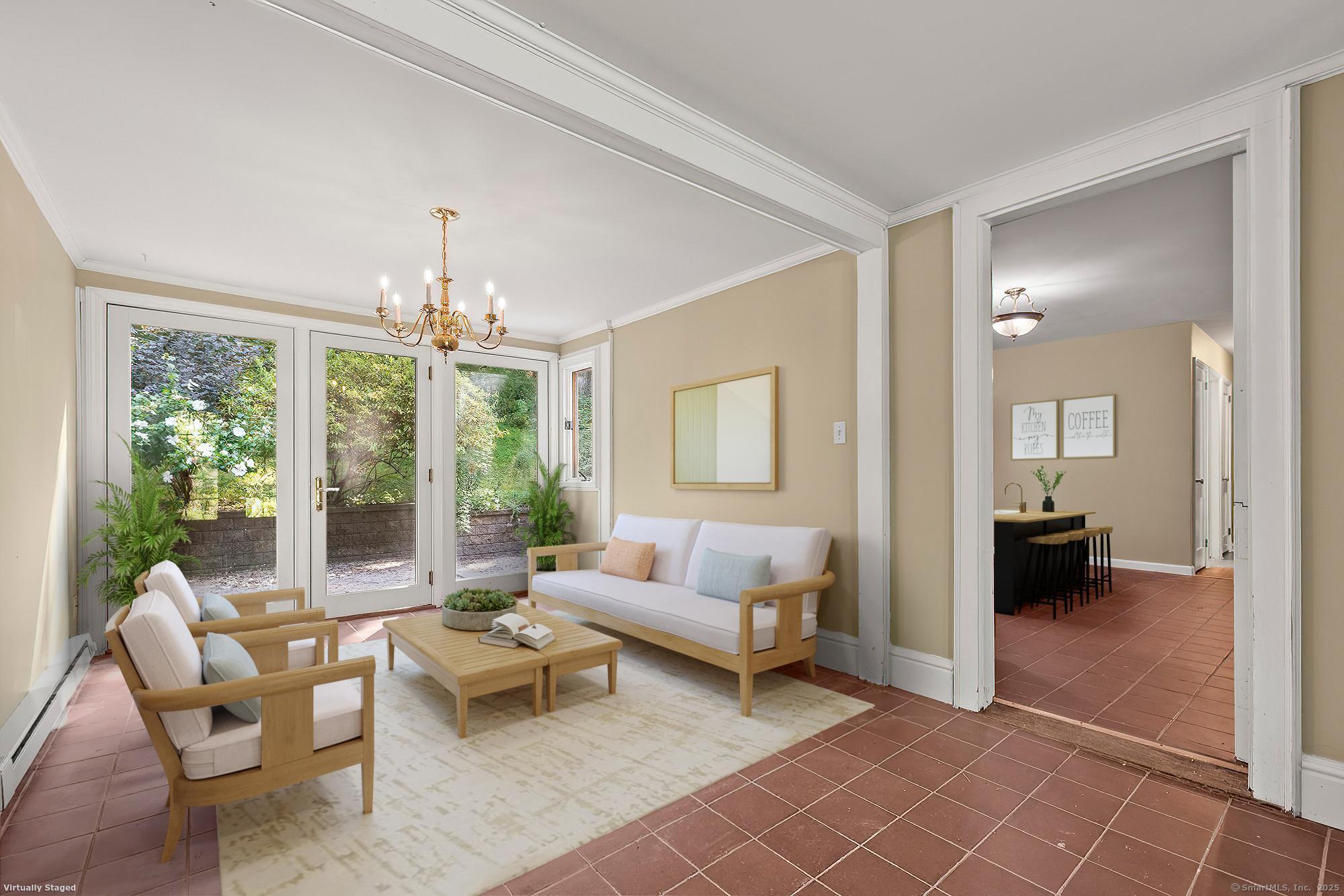 15 Laurel Hill Road Ridgefield, CT 06877 - Photo 11 of 34 a living room with furniture and a chandelier