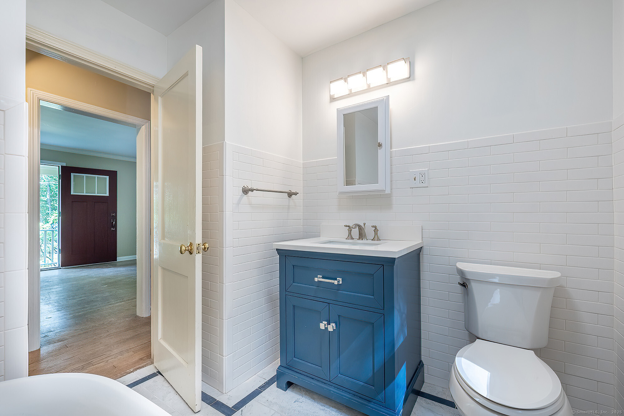 15 Laurel Hill Road Ridgefield, CT 06877 - Photo 13 of 34 a bathroom with a toilet a sink and mirror