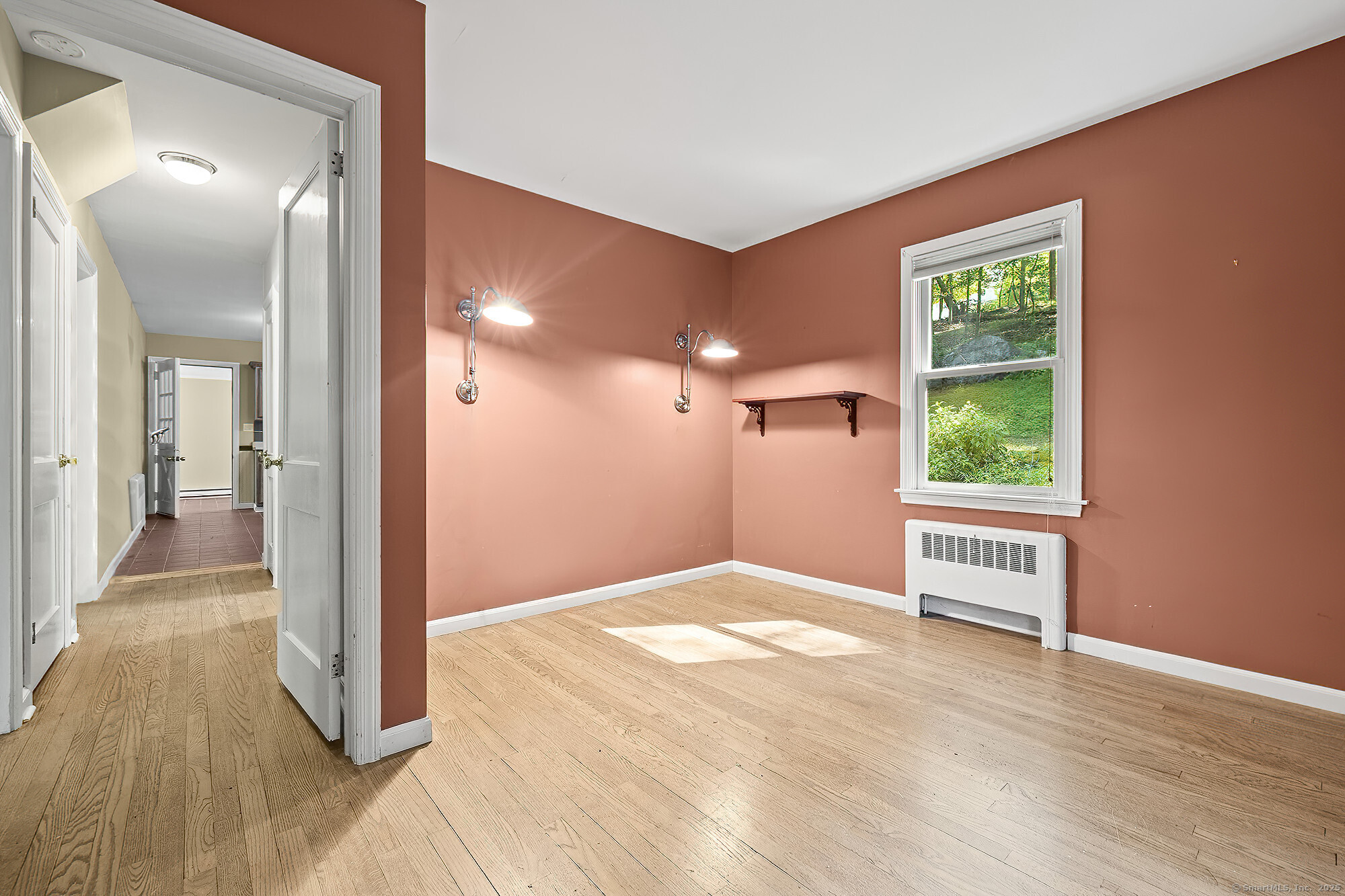15 Laurel Hill Road Ridgefield, CT 06877 - Photo 16 of 34 a view of a hallway with wooden floor and a bathroom