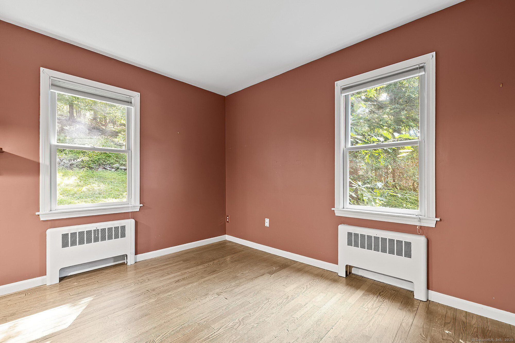 15 Laurel Hill Road Ridgefield, CT 06877 - Photo 17 of 34 an empty room with wooden floor and windows