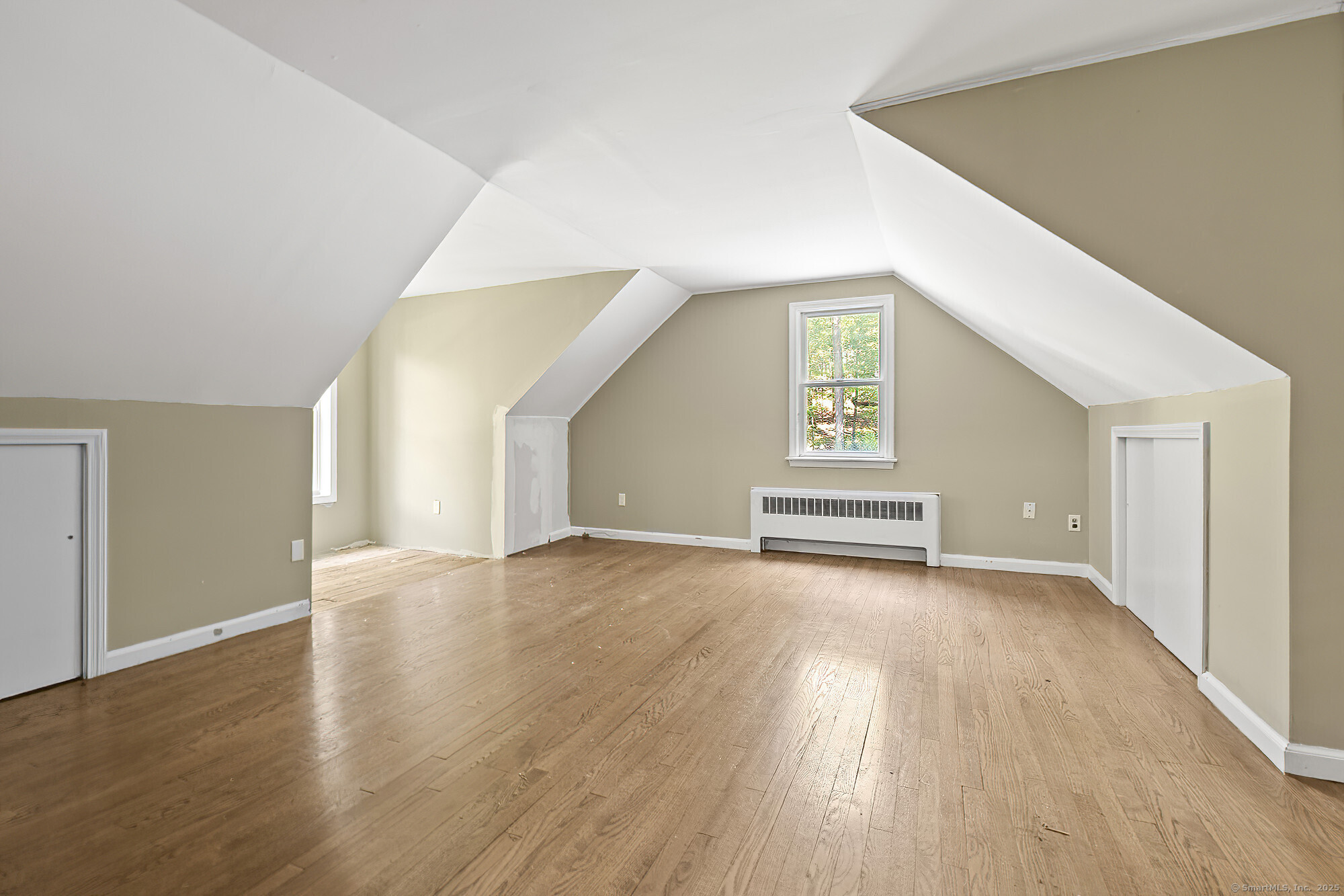 15 Laurel Hill Road Ridgefield, CT 06877 - Photo 24 of 34 a view of a big room with wooden floor and windows