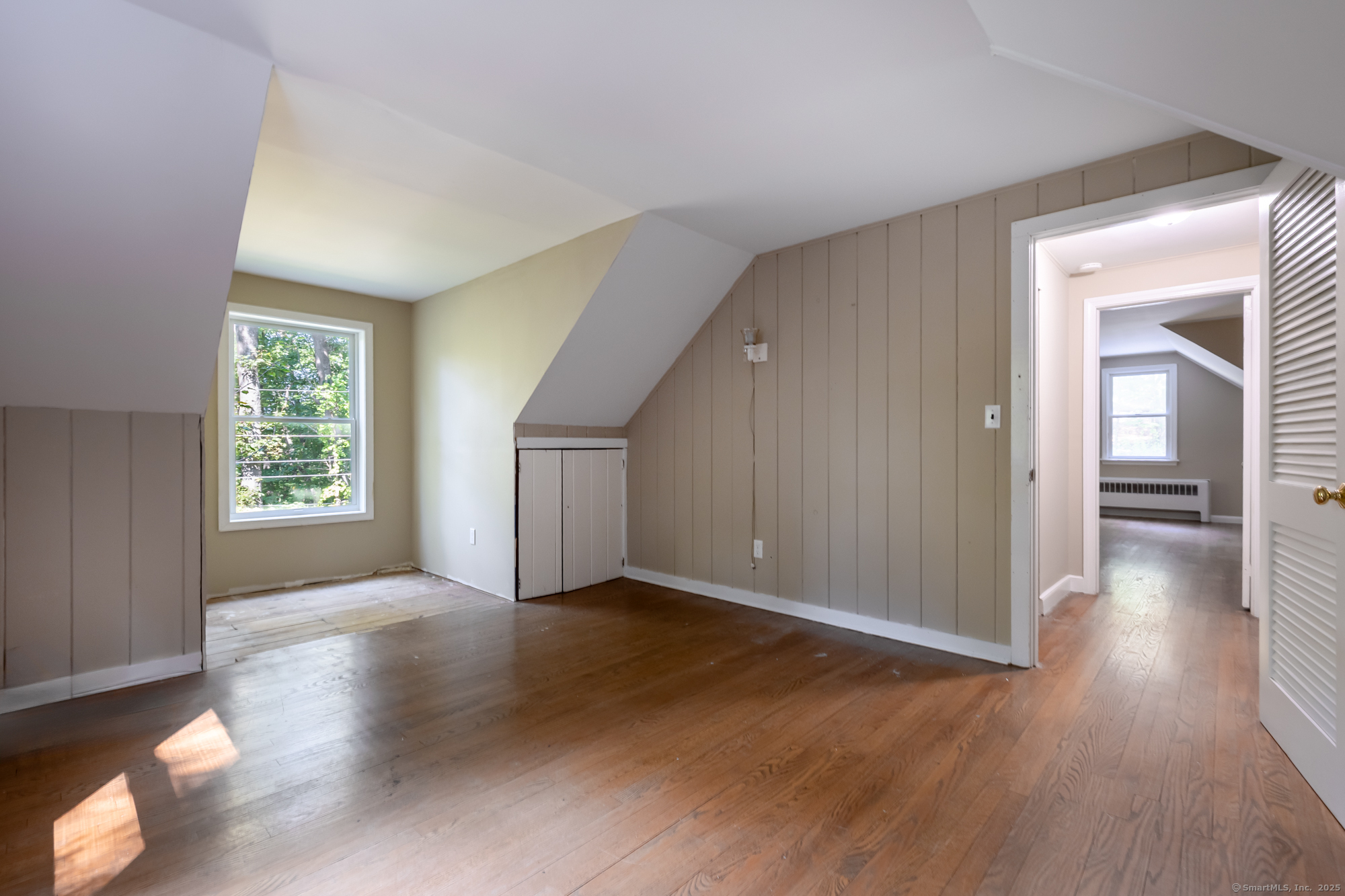 15 Laurel Hill Road Ridgefield, CT 06877 - Photo 27 of 34 an empty room with wooden floor and windows