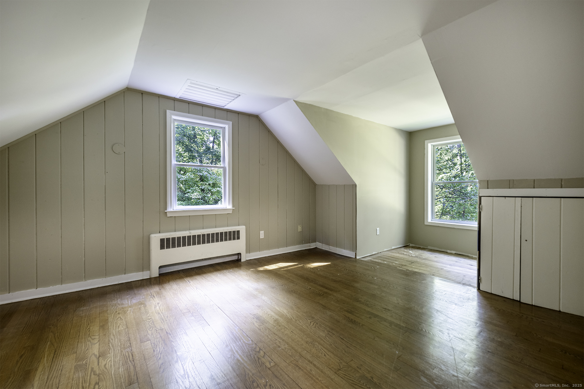 15 Laurel Hill Road Ridgefield, CT 06877 - Photo 28 of 34 an empty room with wooden floor and windows