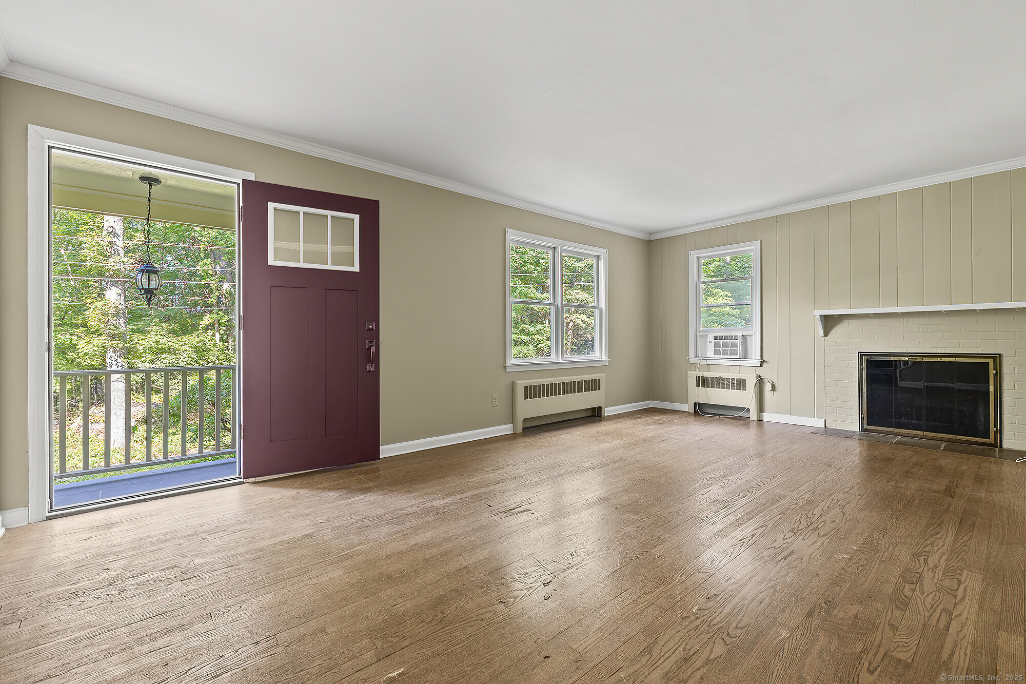 15 Laurel Hill Road Ridgefield, CT 06877 - Photo 5 of 34 a view of empty room with wooden floor and fireplace