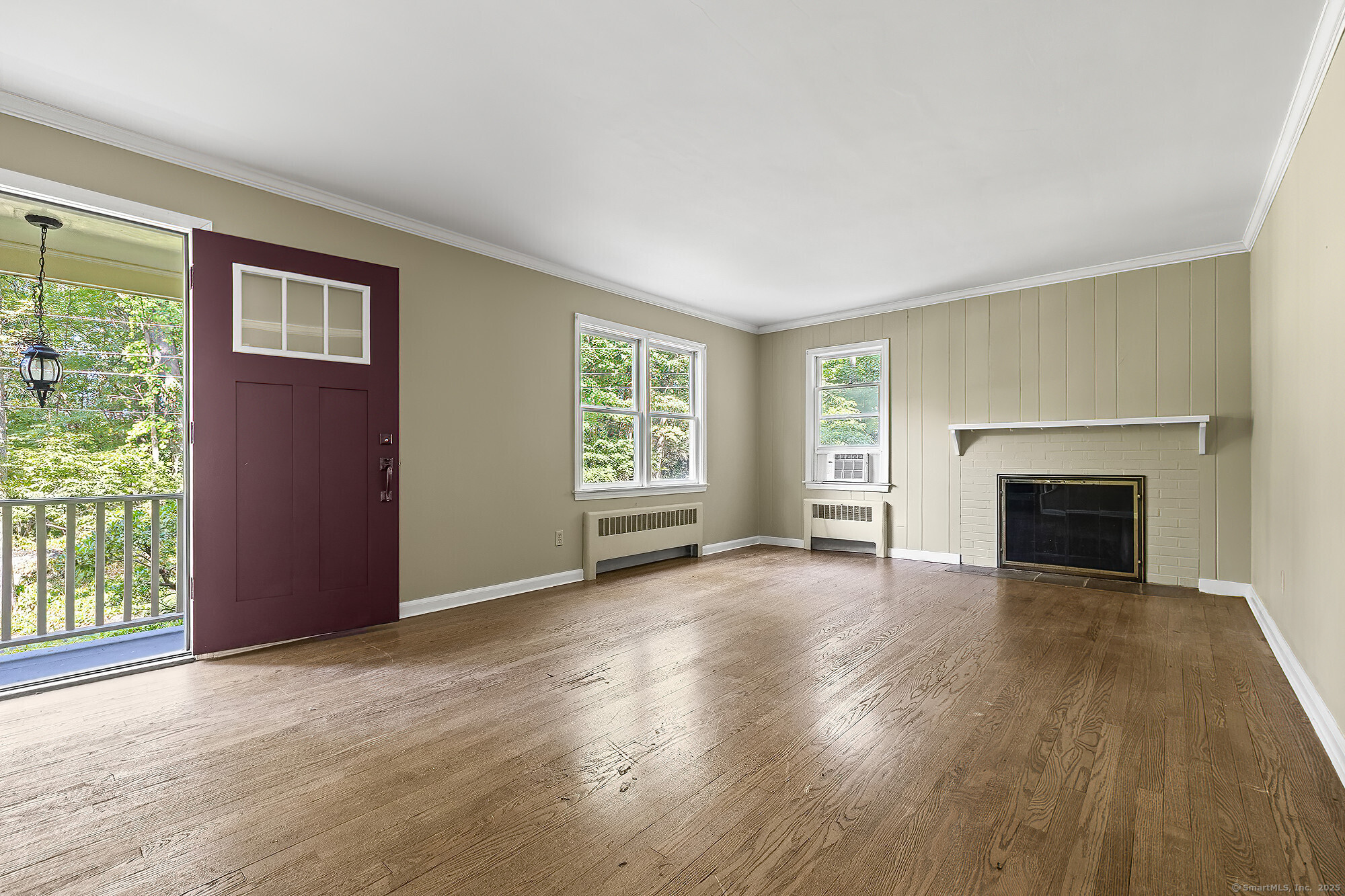 15 Laurel Hill Road Ridgefield, CT 06877 - Photo 7 of 34 an empty room with windows and fireplace