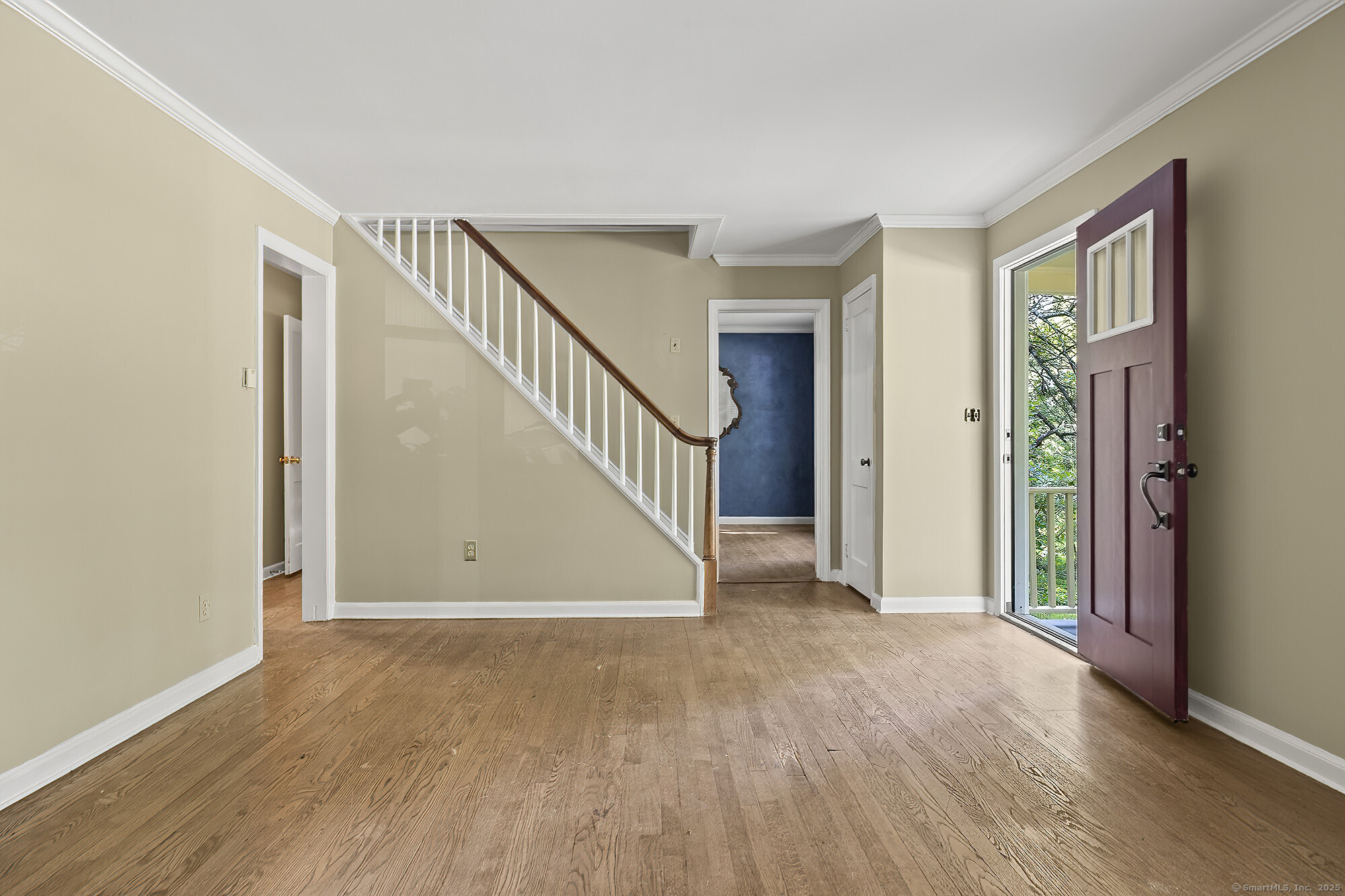 15 Laurel Hill Road Ridgefield, CT 06877 - Photo 8 of 34 a view of an empty room with wooden floor and stairs