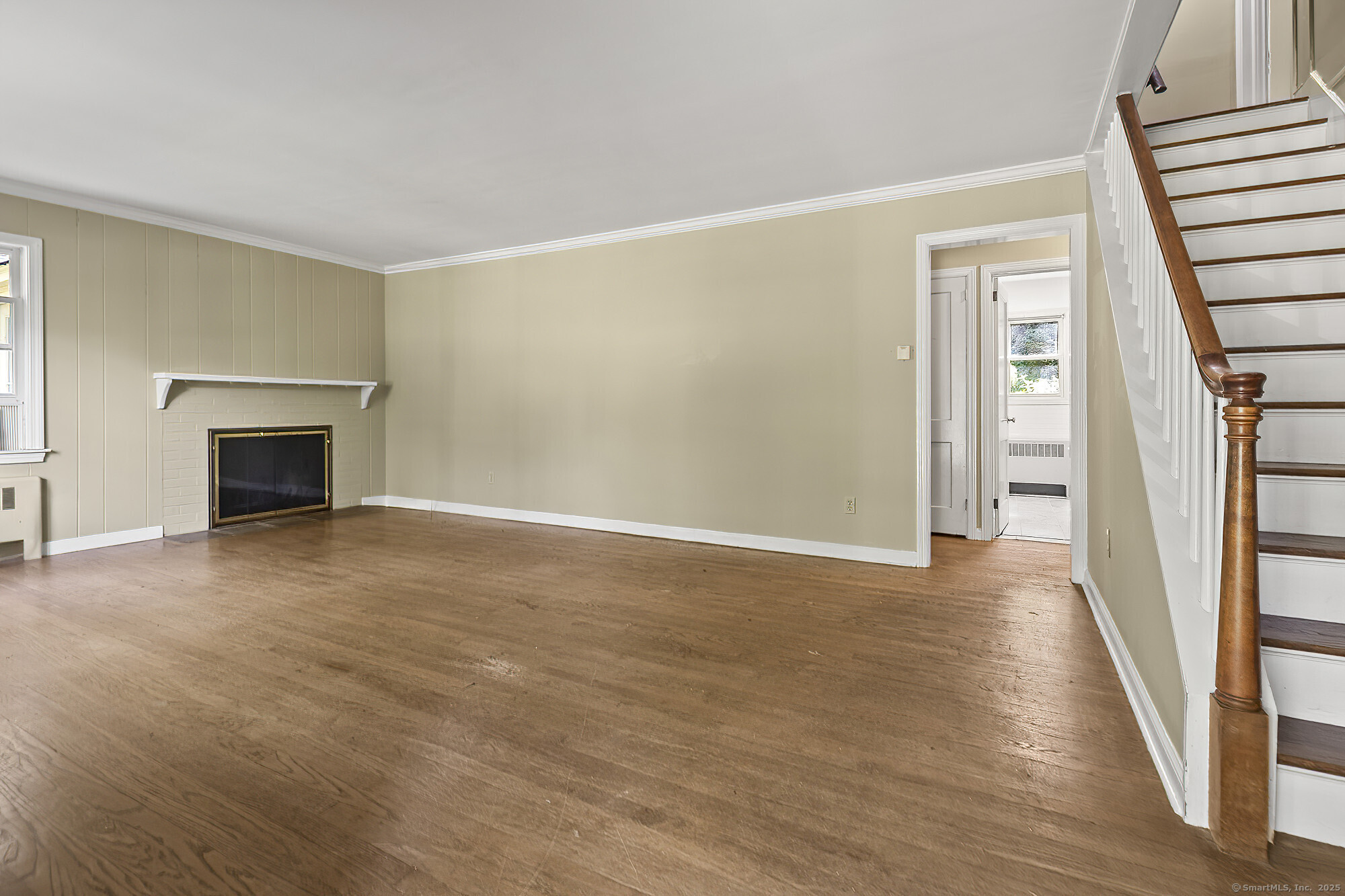 15 Laurel Hill Road Ridgefield, CT 06877 - Photo 9 of 34 a view of empty room with wooden floor and fireplace