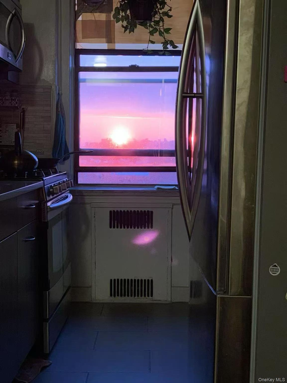 40-35 Ithaca Street, Unit 5B Queens, NY 11373 - Photo 7 of 10 Kitchen view of appliances with stainless steel finishes