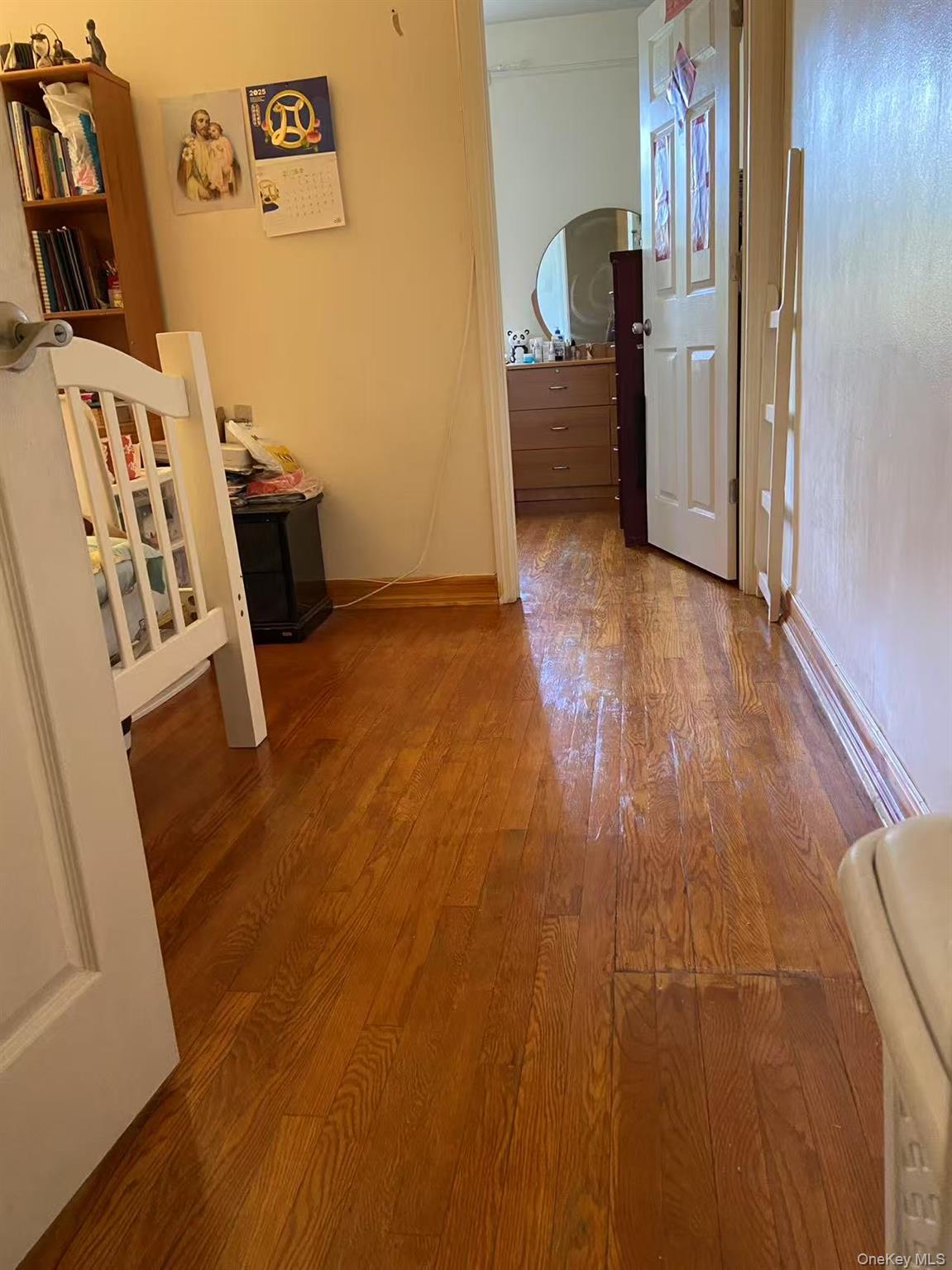 40-35 Ithaca Street, Unit 5B Queens, NY 11373 - Photo 10 of 10 Hall with wood finished floors and baseboards