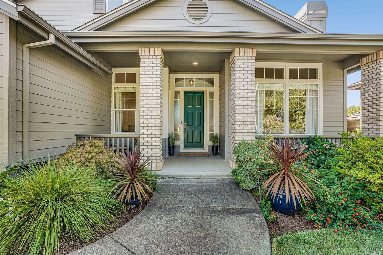 a view of front door and potted plants