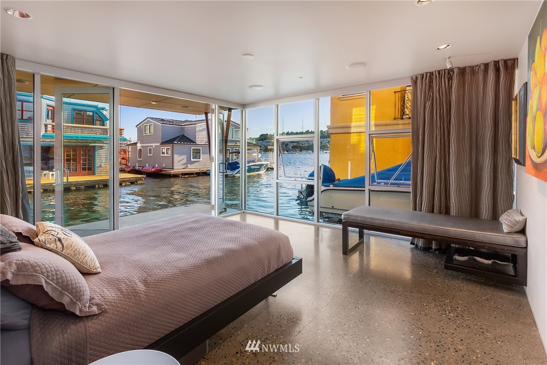 2369 Fairview Avenue East, Unit 6 Seattle, WA 98102 - Photo 13 of 26 a bedroom with a bed and large window