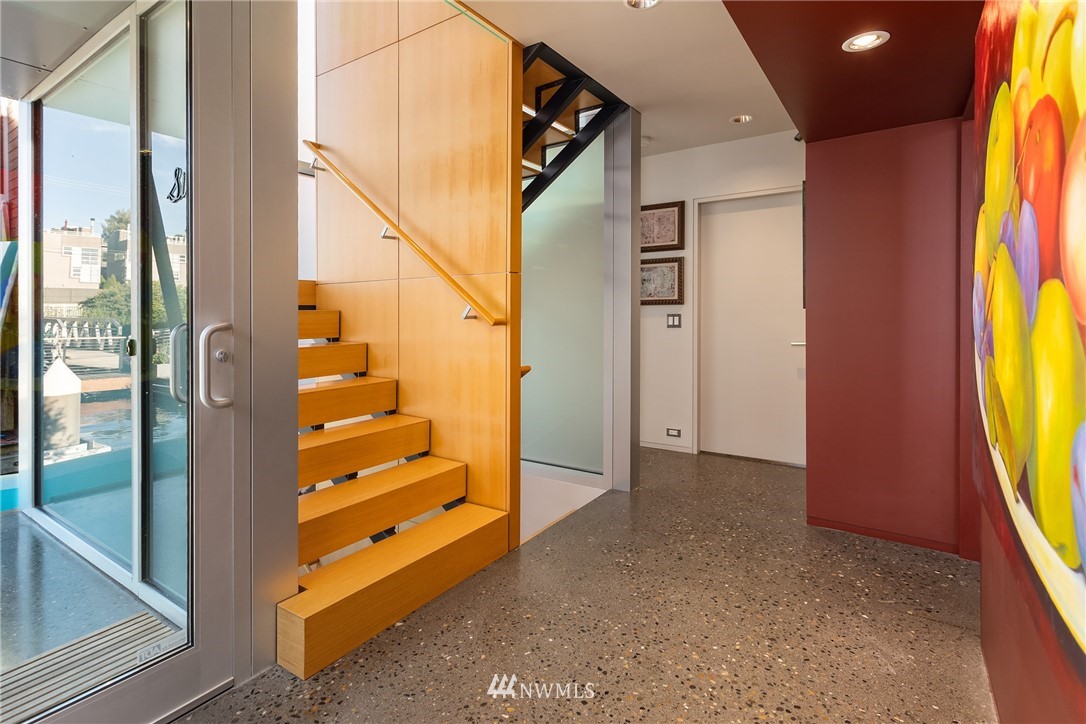 2369 Fairview Avenue East, Unit 6 Seattle, WA 98102 - Photo 3 of 26 a view of hallway with windows and wooden floor