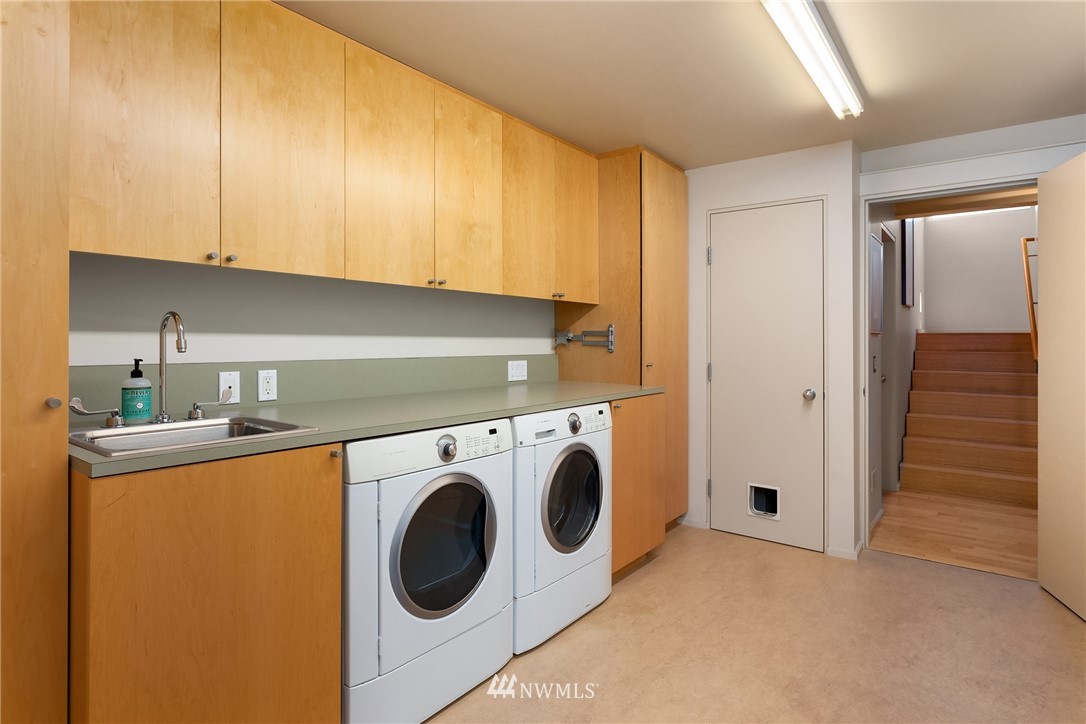 2369 Fairview Avenue East, Unit 6 Seattle, WA 98102 - Photo 22 of 26 a utility room with dryer and washer