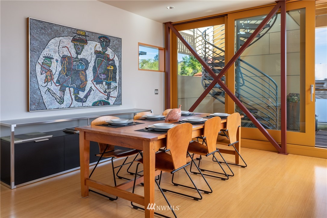 2369 Fairview Avenue East, Unit 6 Seattle, WA 98102 - Photo 8 of 26 a dining room with furniture and wooden floor
