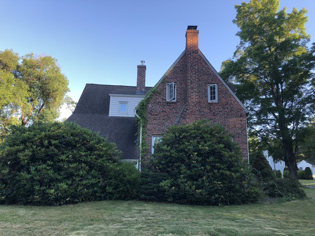 65 Peekskill Avenue Springfield, MA 01129 - Photo 2 of 12 a front view of a house with a yard