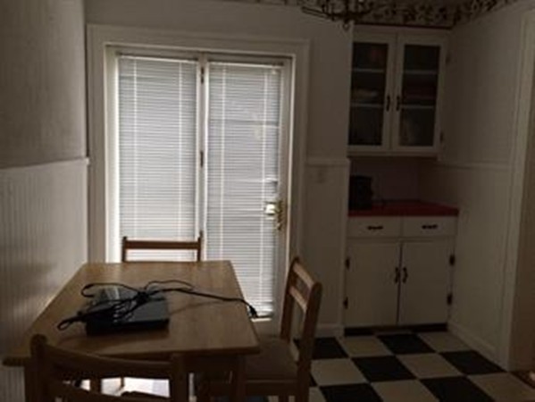 65 Peekskill Avenue Springfield, MA 01129 - Photo 6 of 12 a black leather chair sitting in front of a window