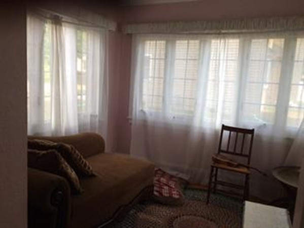 65 Peekskill Avenue Springfield, MA 01129 - Photo 8 of 12 a bedroom with a bed and wooden floor