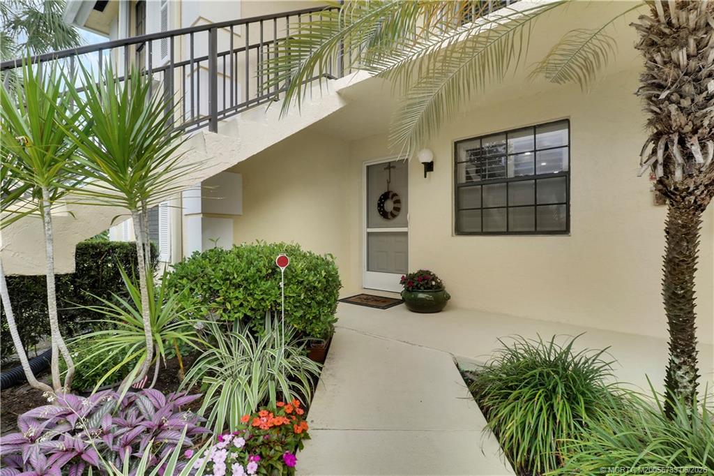 1001 Keystone Drive, Unit A Jupiter, FL 33458 - Photo 2 of 30 a potted plant sitting in front of a house