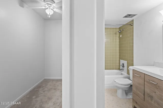 a bathroom with a toilet a sink and shower