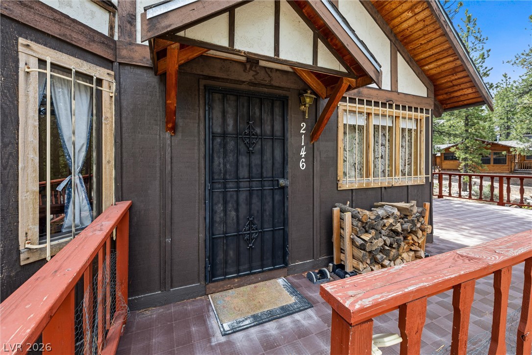 2146 Via Spes Nostra Street Mount Charleston, NV 89124 - Photo 10 of 33 A charming exterior with a secure entry and welcoming porch for outdoor enjoyment.
