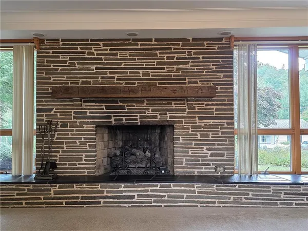 a view of fireplace and window