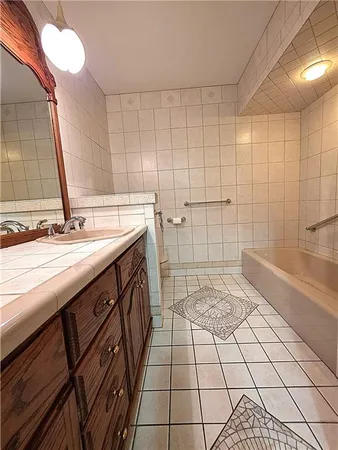 a bathroom with a sink a toilet and a bathtub