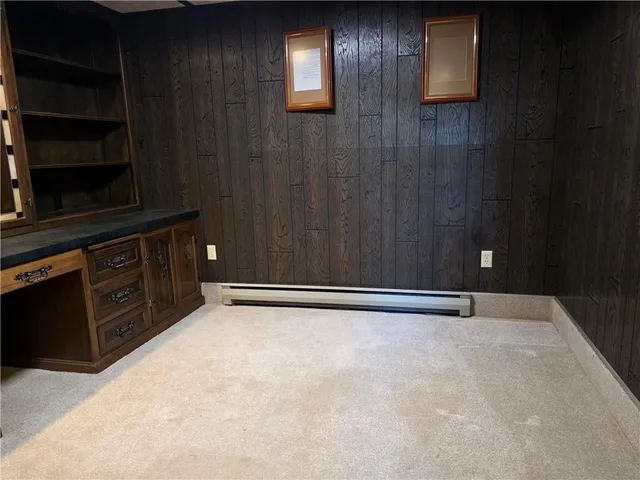 a view of an empty room with a cabinet