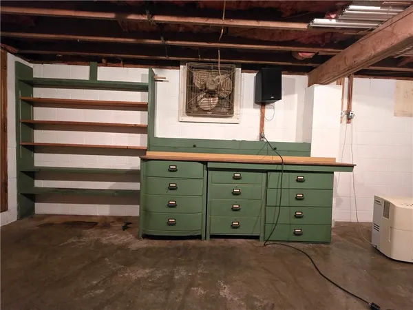 a room with a dresser and a window