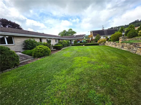 a view of backyard with sitting area
