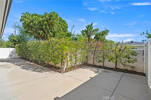 a view of staircase with lots of frames on wall
