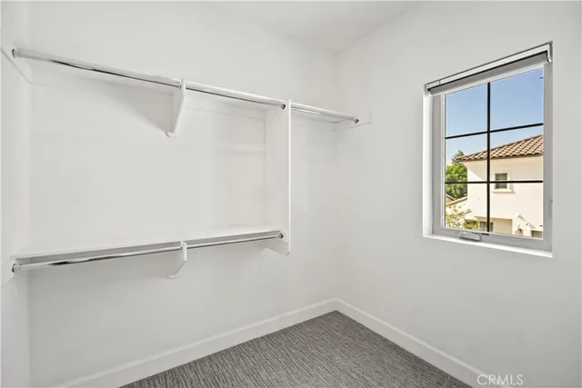 a spacious bathroom with sinks mirror and a bathtub