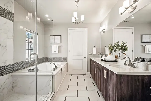 a bathroom with a double vanity sink mirror and next to a window