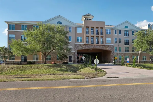 a front view of building with yard