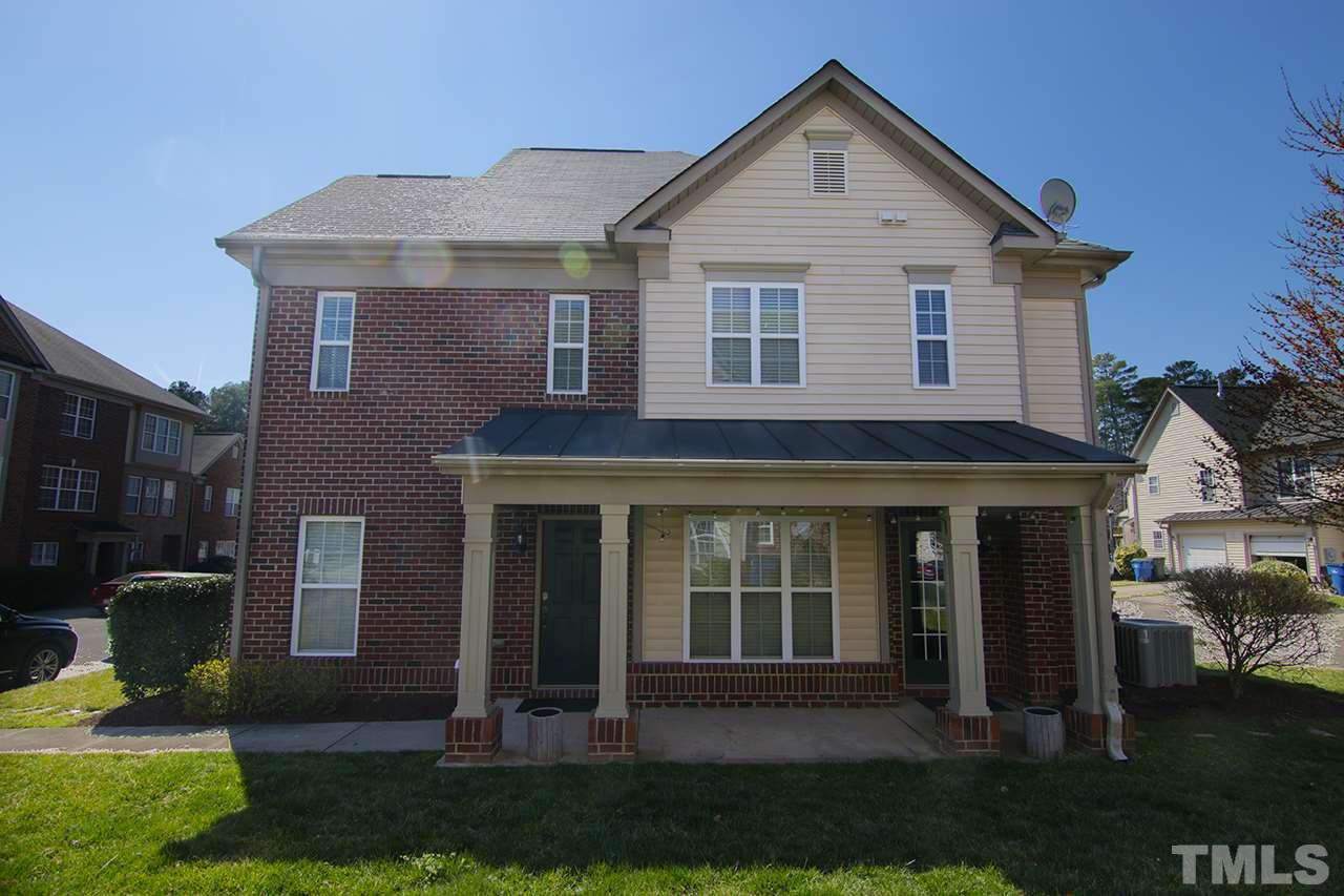 9820 Layla Avenue Raleigh, NC 27617 - Photo 1 of 17 a front view of a house with a yard
