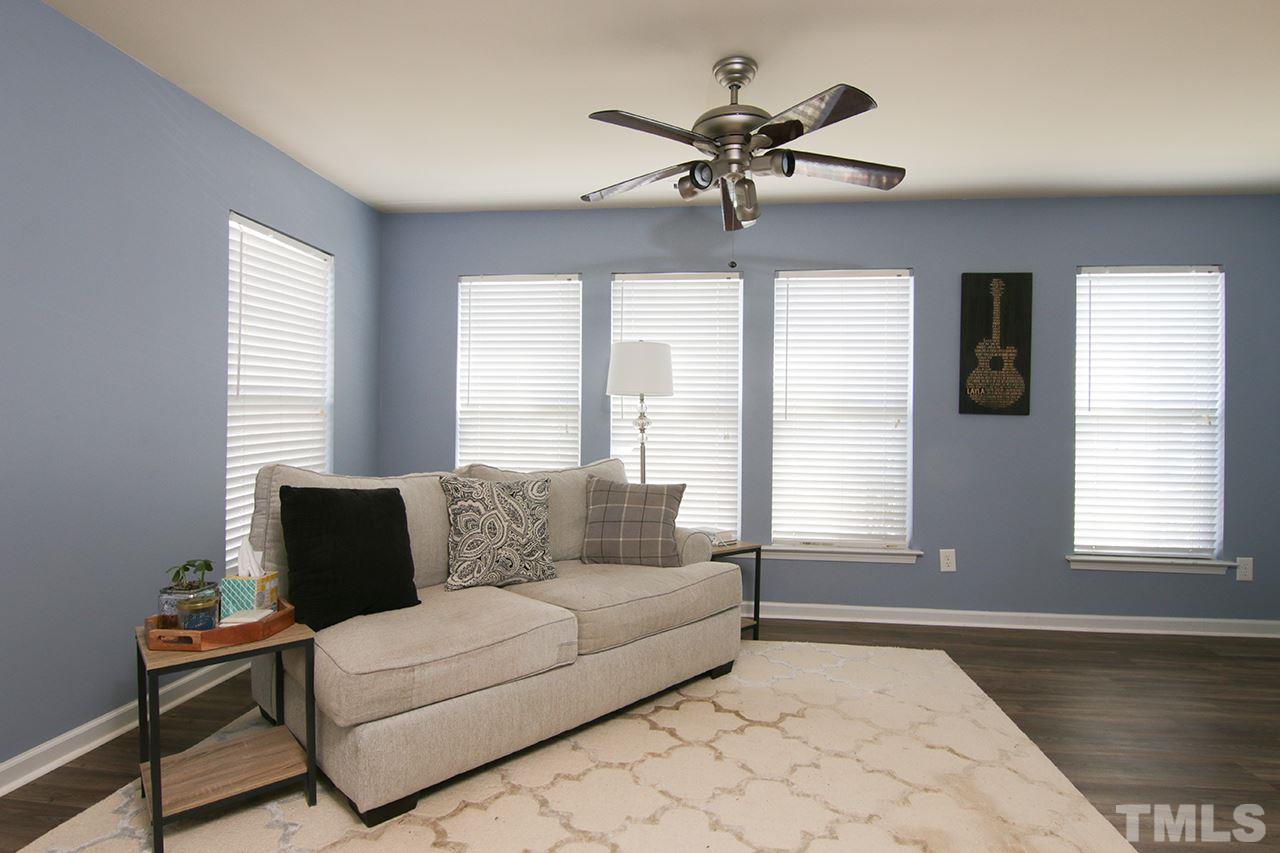 9820 Layla Avenue Raleigh, NC 27617 - Photo 8 of 17 a living room with furniture and windows