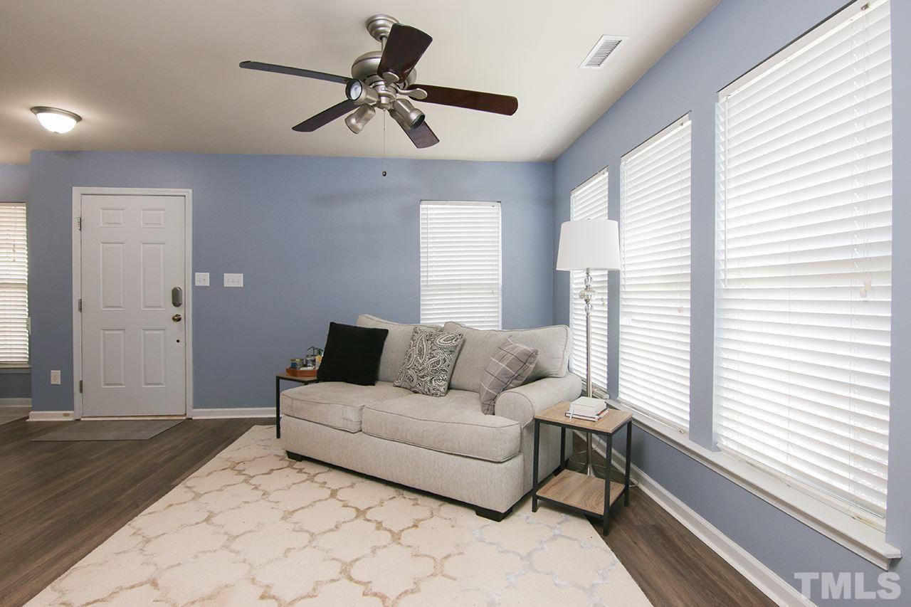 9820 Layla Avenue Raleigh, NC 27617 - Photo 9 of 17 a living room with furniture and a window