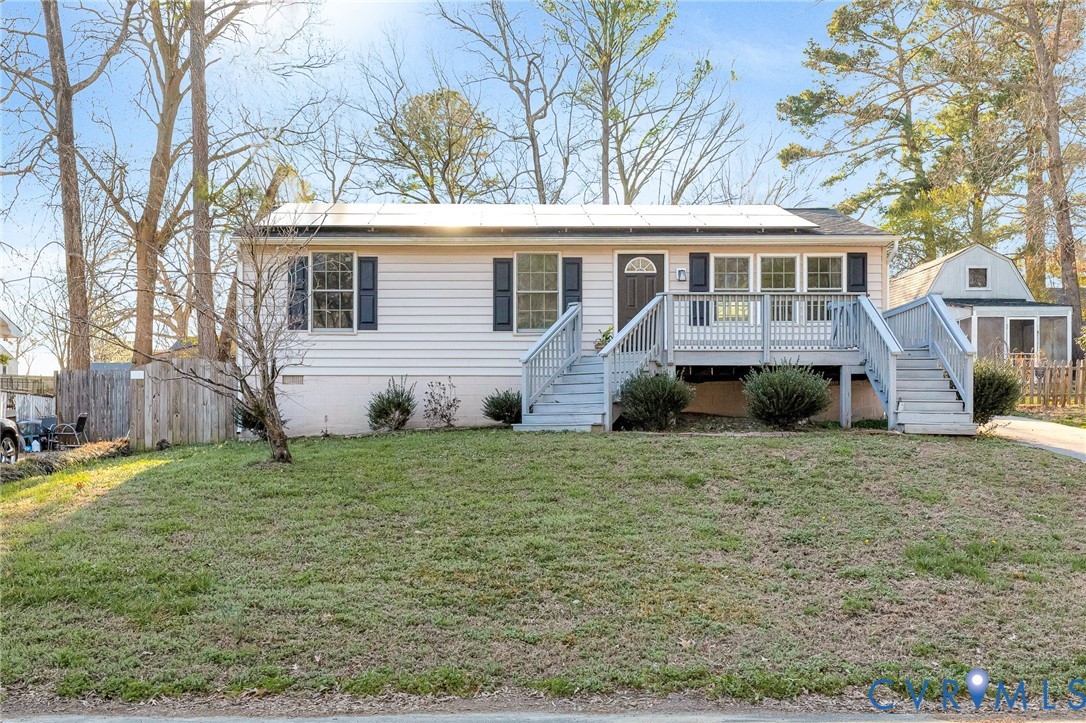 16004 Gary Avenue Chester, VA 23831 - Photo 1 of 26 a front view of a house with a garden