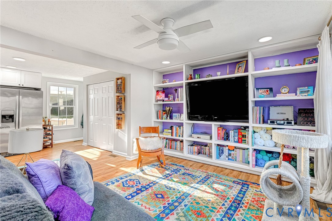 16004 Gary Avenue Chester, VA 23831 - Photo 13 of 26 a living room with furniture and a flat screen tv