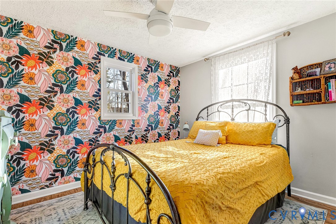 16004 Gary Avenue Chester, VA 23831 - Photo 14 of 26 a bedroom with a bed and a window