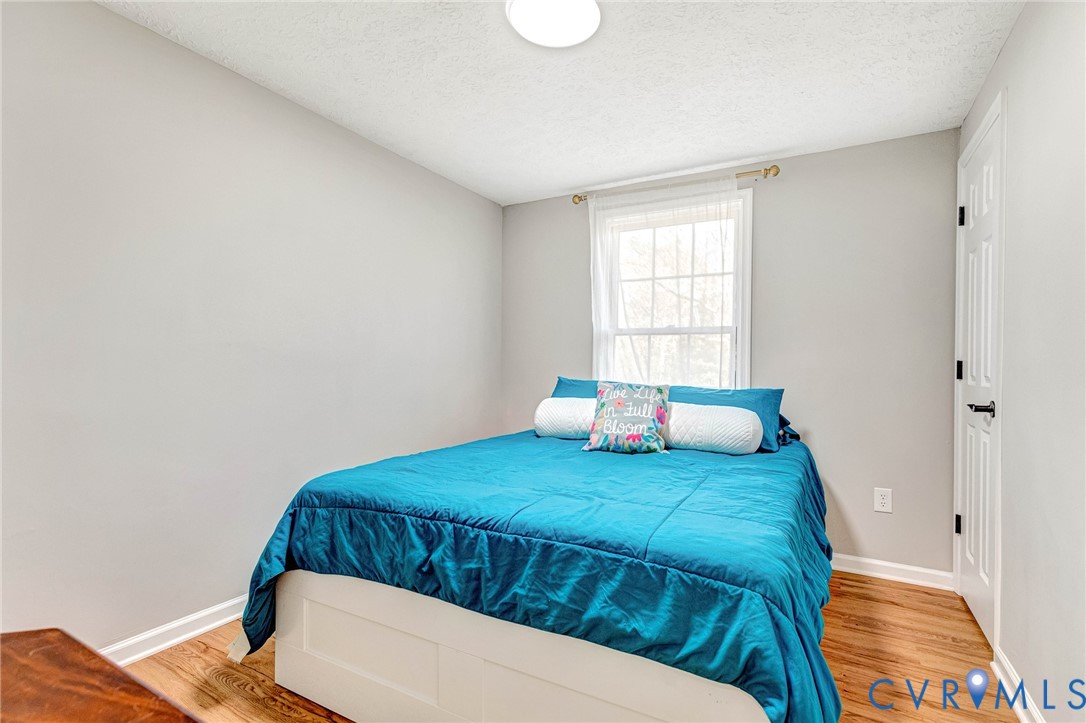 16004 Gary Avenue Chester, VA 23831 - Photo 20 of 26 a bedroom with a bed and a window