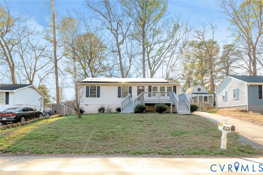 16004 Gary Avenue Chester, VA 23831 - Photo 2 of 26 a front view of a house with a yard