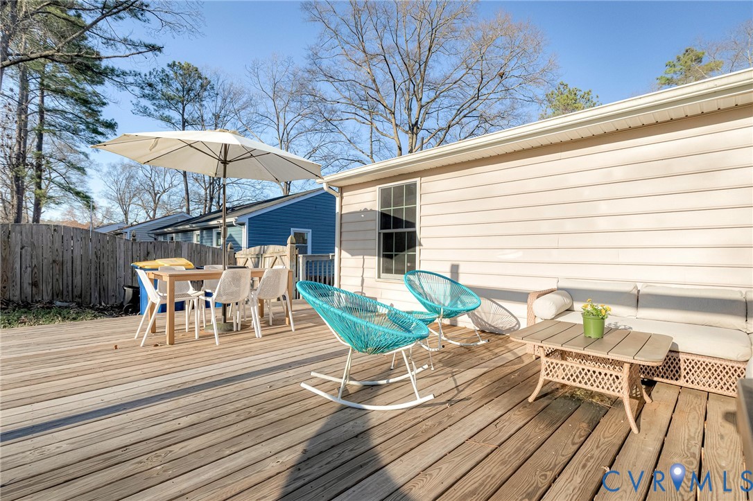 16004 Gary Avenue Chester, VA 23831 - Photo 23 of 26 a view of a chairs and table on the wooden floor