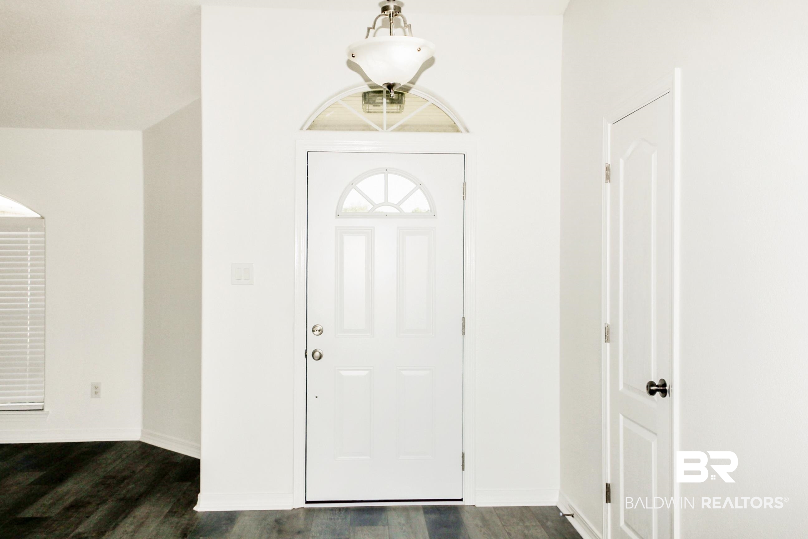 14750 Pawnee Court Foley, AL 36535 - Photo 8 of 34 Entryway with dark wood-type flooring and baseboards