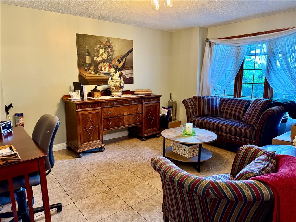 293 Sandy Hill Road Valencia, PA 16059 - Photo 21 of 50 a living room with furniture a rug and a window